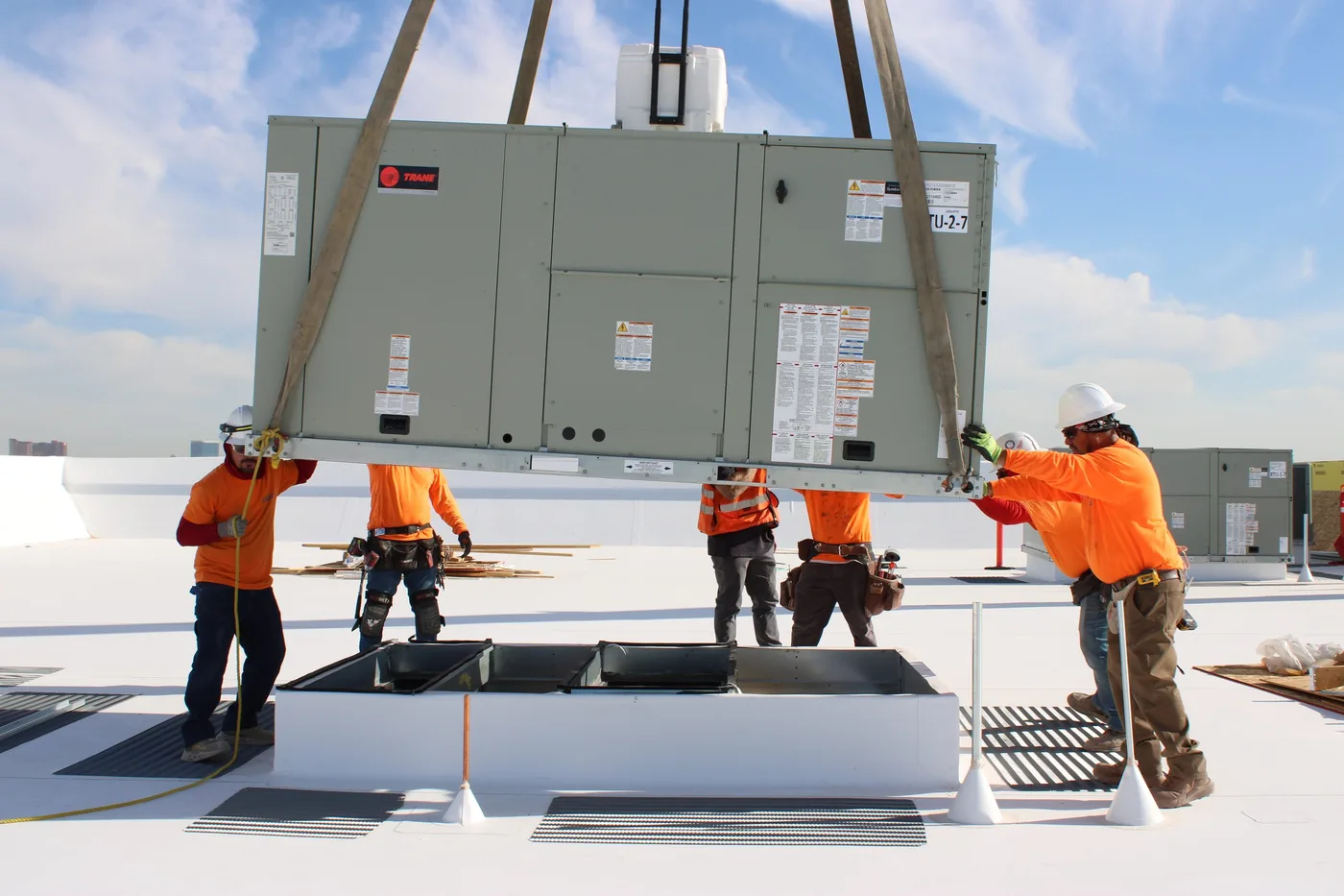No Sweat Mechanical crew crane-setting a rooftop unit