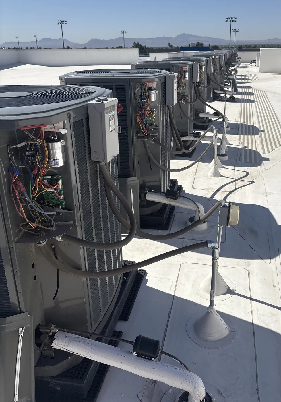 NSM technician inspecting a commercial HVAC unit