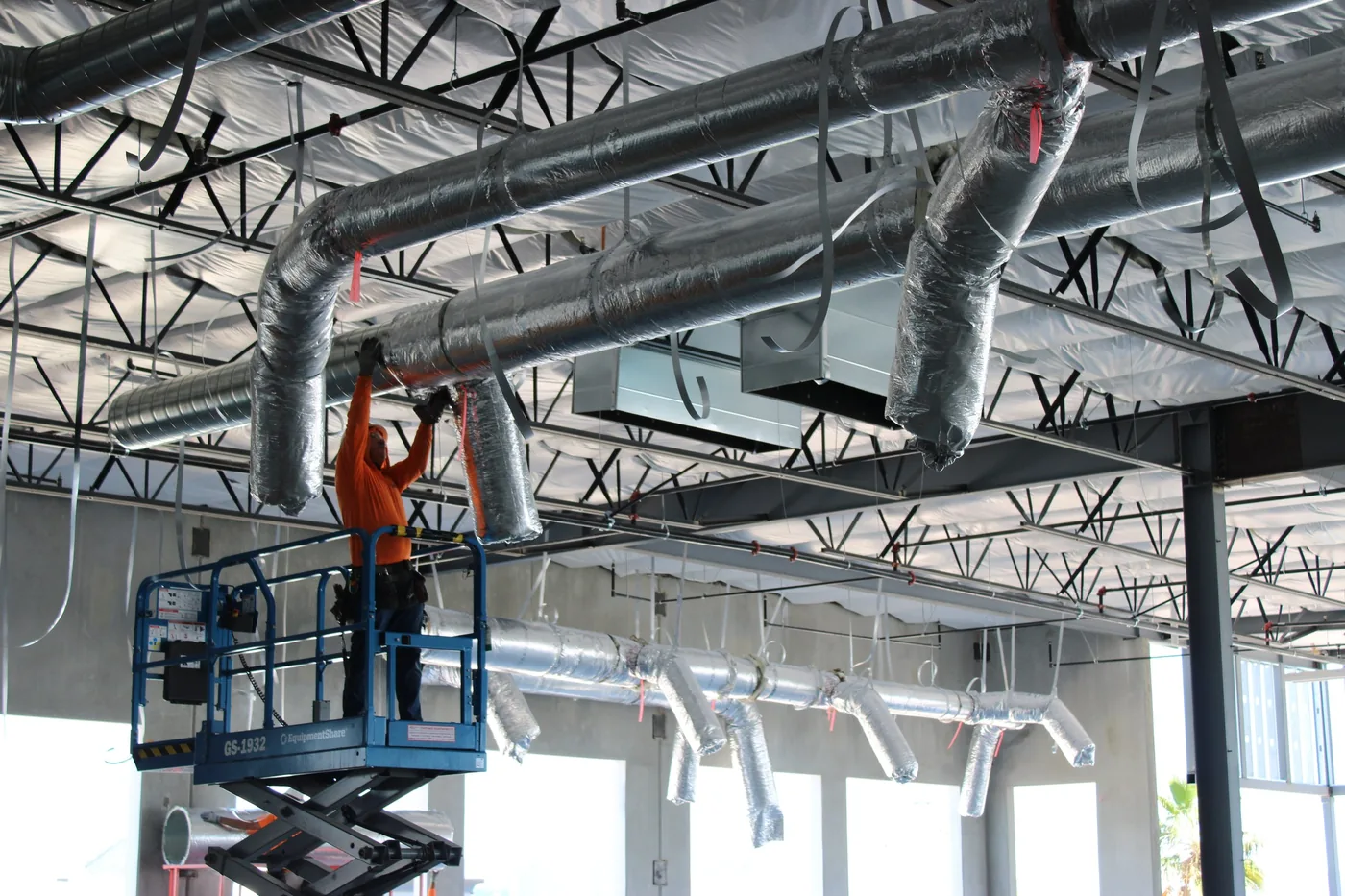 NSM crew installing commercial ductwork